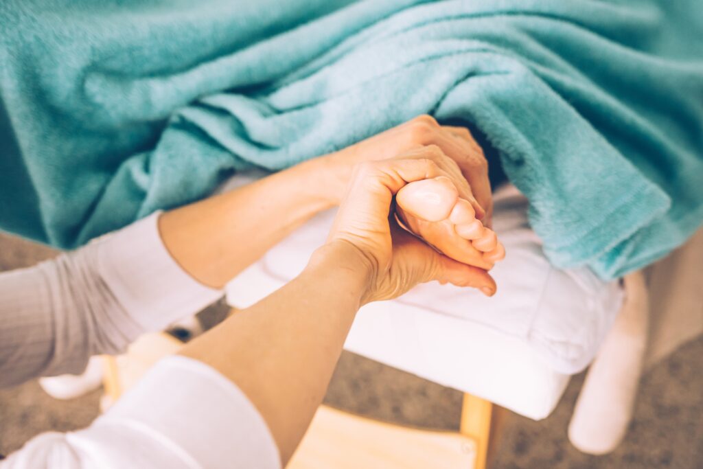 caucasian,hands,giving,a,foot,massage,,reflexology